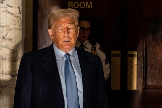 <p>Former US President Donald Trump speaks to reporters as he takes a break during his civil fraud trial in New York City on October 18, 2023</p>