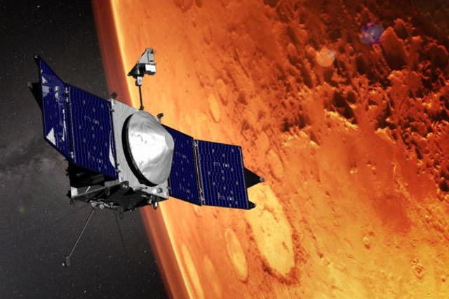 <p>This illustration shows the MAVEN spacecraft and the limb of Mars</p>