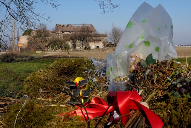 <p>File A stuffed toy squirrel and by now long dried flowers are left in tribute near the ruins of a farmhouse in Novellara, northern Italy, Friday</p>