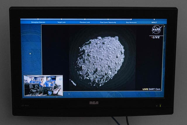 <p>A television at NASA’s Kennedy Space Center in Cape Canaveral, Florida, captures the final images from the Double Asteroid Redirection Test (DART) just before it smashes into the asteroid Dimorphos on September 26, 2022</p>