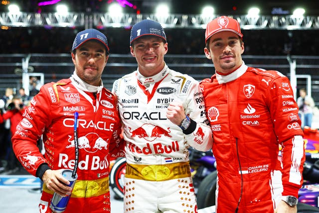 <p>Race winner Max Verstappen celebrates with third-placed Red Bull teammate Sergio Perez (left) and Ferrari’s runner-up Charles Leclerc</p>