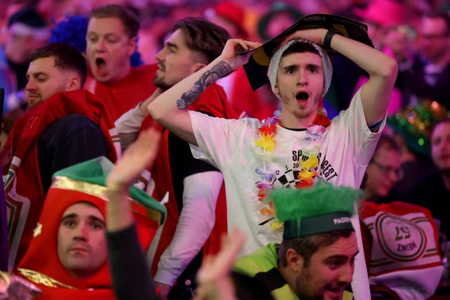 <p>Fans at the opening night of the World Darts Championship </p>