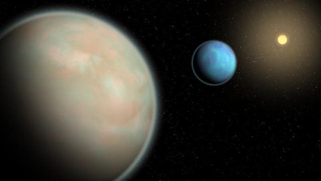 <p>An illustration of two water-rich exoplanets with hazy atmospheres.</p>