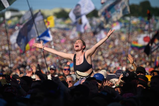 <p>People sing along as Lewis Capaldi performs on the Pyramid Stage on day four of Glastonbury 2023</p>