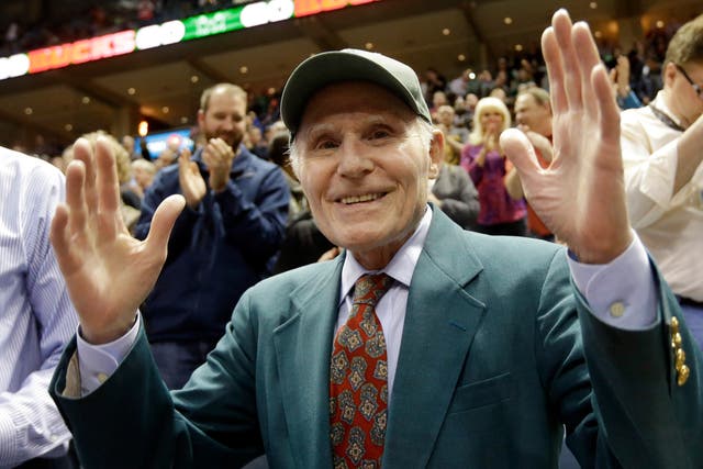 <p>Herb Kohl waves to fans during a Bucks game in April 2014</p>
