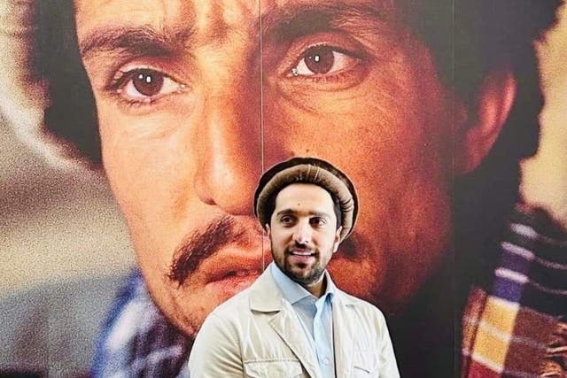 <p>Ahmad Massoud stands in front of a portrait of his father, the revered Afghan guerrilla commander Ahmad Shah Massoud</p>