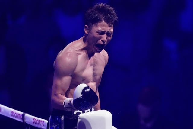 <p>Naoya Inoue celebrates stopping Stephen Fulton to take his super-bantamweight belts</p>