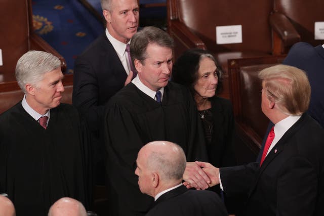 <p>President Donald Trump greets Supreme Court Justice Brett Kavanaugh after the State of the Union address in the chamber of the U.S. House of Representatives at the U.S. Capitol Building on February 5, 2019 in Washington, DC</p>
