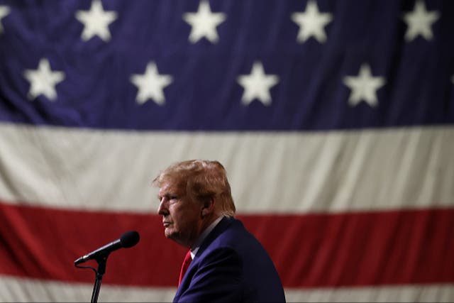 <p> Republican Presidential candidate former US president Donald Trump looks on during a campaign rally at the Reno-Sparks Convention Center on 17 December 2023 in Reno, Nevada.</p>
