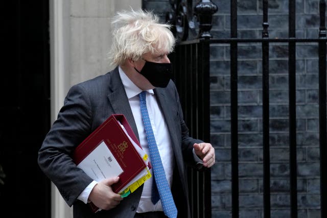 <p>Boris Johnson leaves 10 Downing Street in a face mask </p>