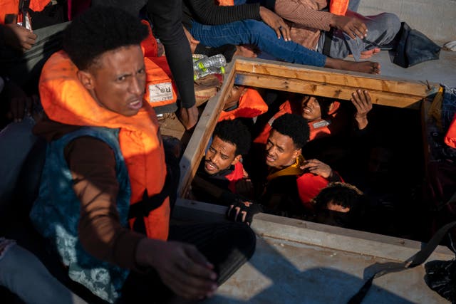 <p>File image: Migrants from Eritrea, Libya and Sudan are crowded in the hold of a wooden boat before being assisted by aid workers</p>