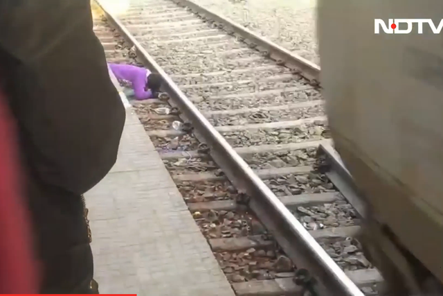 <p>A mother in India saves her two children from a train in India  </p>